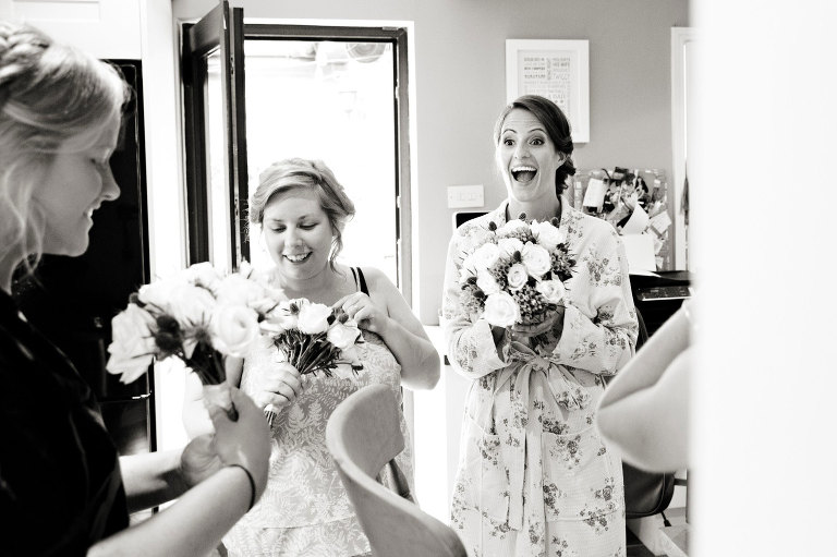 A bride who is very happy with her flowers